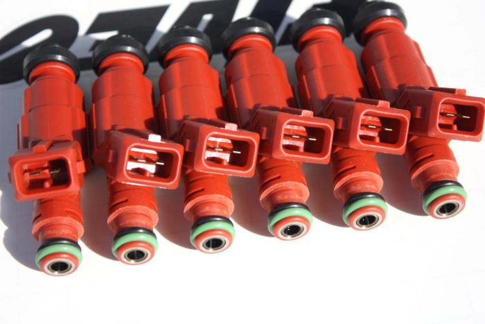 750cc, flow-balanced and matched fuel injectors showing connectors.
